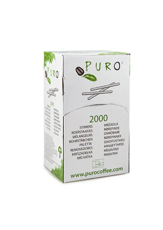Eske med puro kafferørere på hvit bakgrunn, merket "2000 røreverk" med flere språkbeskrivelser og et grønt bladdesign.
