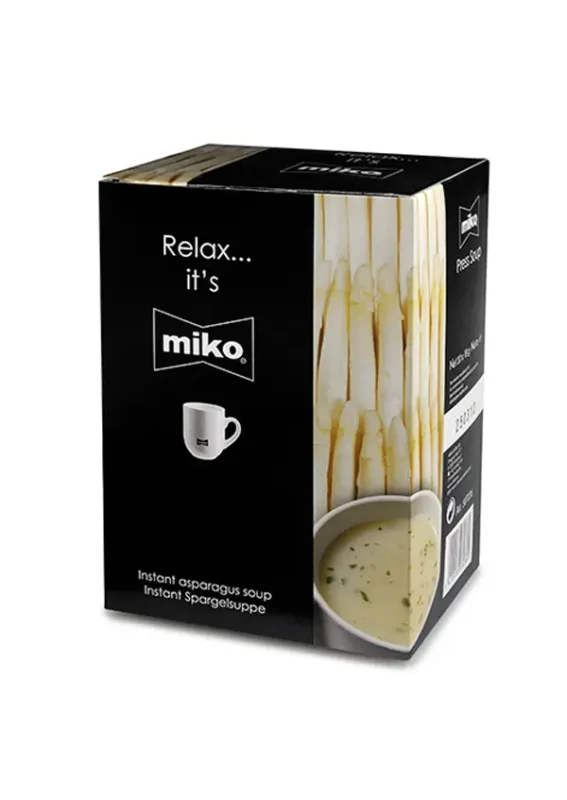 En boks med miko instant aspargessuppe med teksten "slapp av... det er miko" og et bilde av en hvit kopp fylt med suppe, sammen med aspargesstilker.